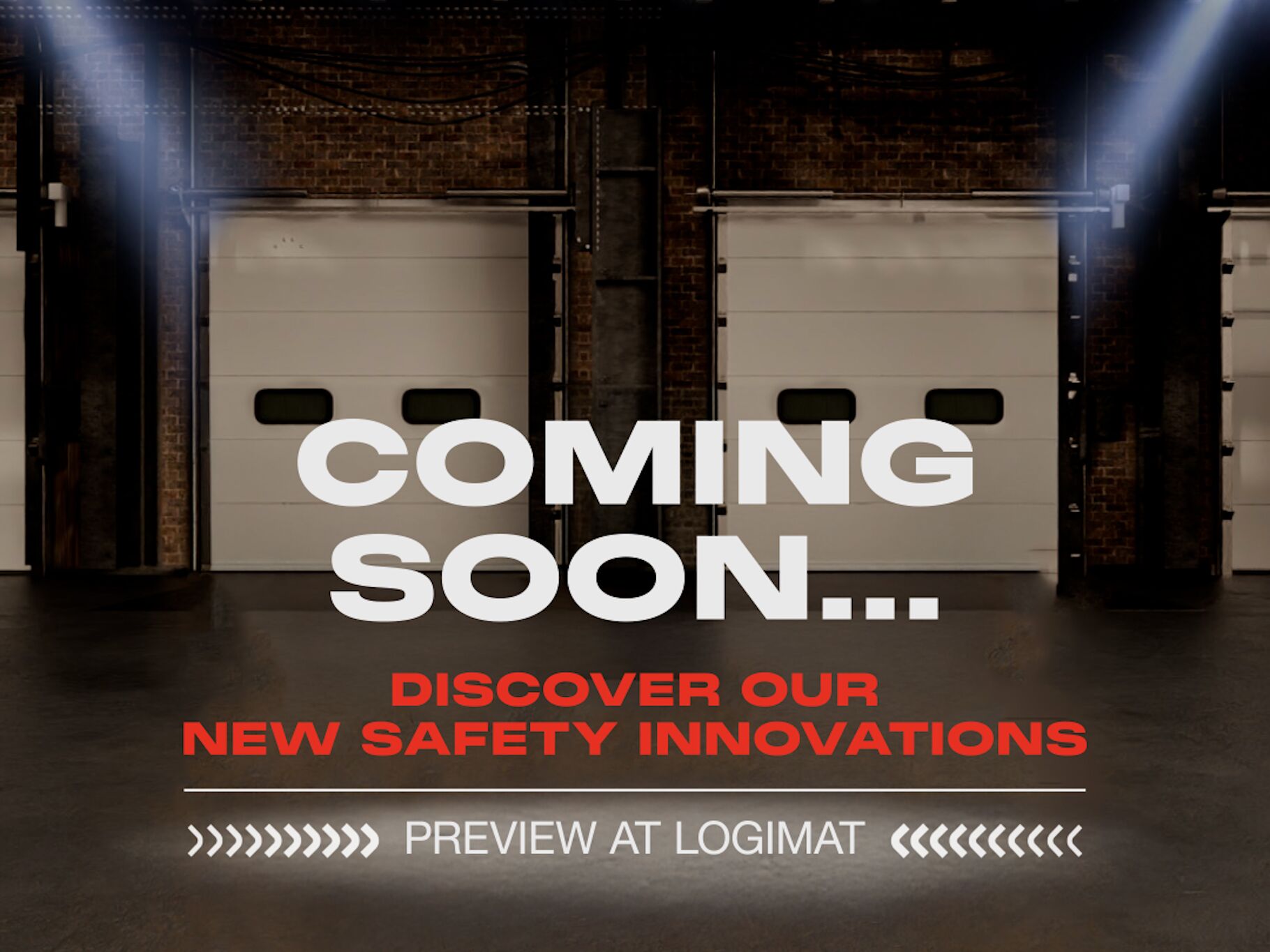 Photo of a coming soon message enlightened by spotlights in a warehouse environment