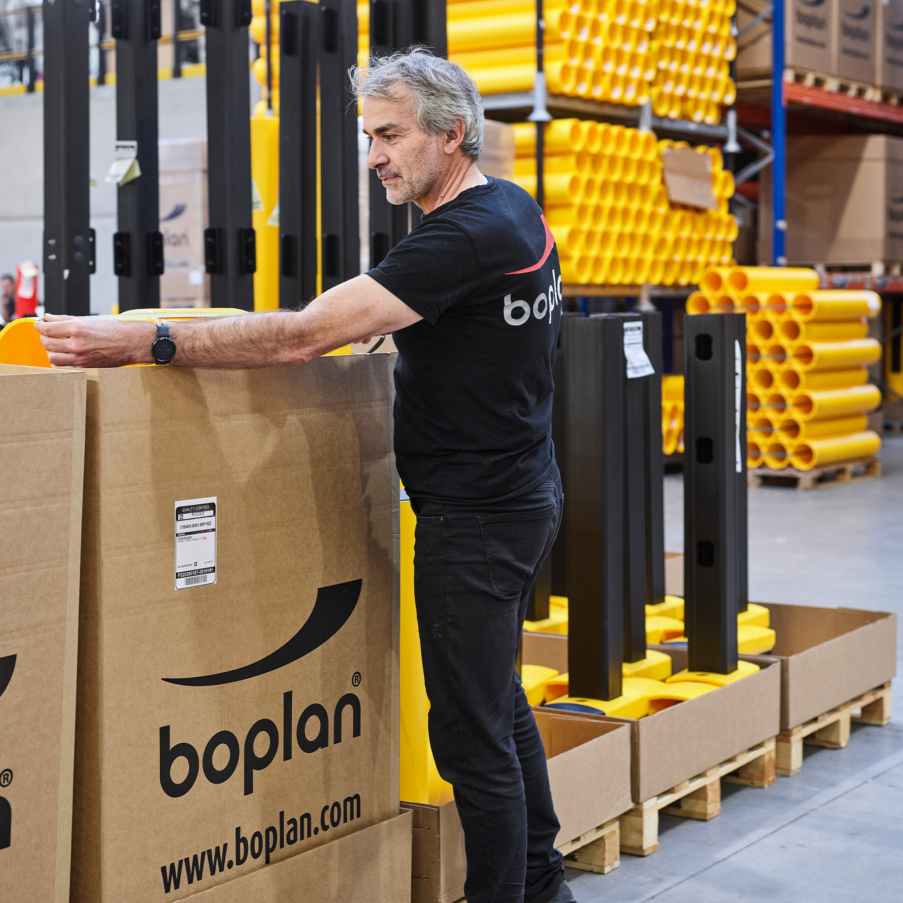 Photo of a Boplan employee performing quality control
