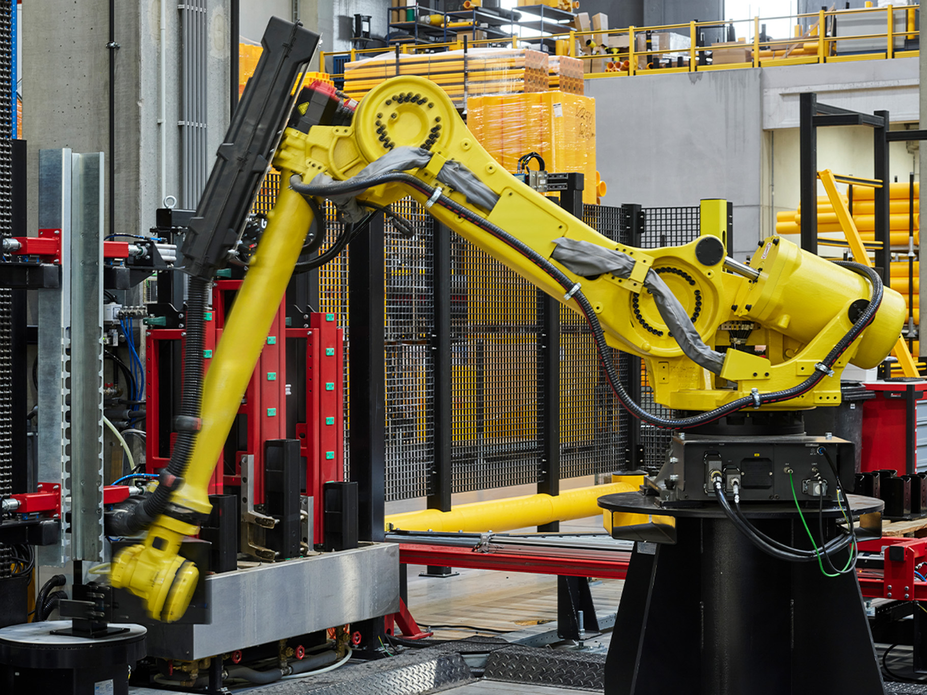 Image of a robotic arm working in the Boplan production hall